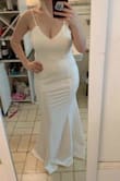 Love this dress. Perfect fit. Just needed a little hemming. Returned because the buttons on the back came off, but they sent a new one instantly! Ended up going with a different dress but this one is perfect for a simple bride to be. - Caitlin M.
