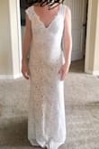 This dress is beautiful! The price is incredible too. It fit well, though it was tight. I don't have a belly, but I will have to suck in if I want to wear this out. (That also might just mean I should have chosen a large size!) I was afraid the lace would look cheap (especially the straps), but it doesn't. The length is perfect. I have a small bust, so the V-neck and this dress actually makes it look like I have a larger bust than I do. Small-chested women, V-necks like this are a great look. The train is elegant as well. - Elaina C.