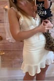 Bought for my bridal shower. It's a pretty dress however the material wrinkles like no other so don't put it on until you have it. It also is extremely short. When you sit down it completely uncovers your butt. - Tessa R.