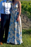 This dress was AMAZING! I didn't have time to go shopping before a wedding, so I ordered 3 dresses and threw this one in the cart just for kicks. It ended up being my favorite one! The material is a super soft satin, which felt very luxurious for an inexpensive dress! It was super easy to steam the wrinkles out of it and it didn't wrinkly quickly. There is a liner inside, which is GREAT for hot outdoor events or parties inside! It wasn't super long, so I only had to get a 2 inch heel; no hemming needed! The little belt was very comfortable and a nice little touch. I really liked that it was just below the breast, which is nice if you have wider hips like I do. The color says it's champagne, but it seemed like a lighter yellow to me. The blues are beautiful on it and the leaves on the flowers are a nice sage green.  I got SO MANY COMPLIMENTS. I'm not kidding when I say at least 15 people complimented my dress. I would recommend this dress to anyone! - Marlana E.