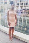 The dress was beautiful overall. Loved the length and fit on my body. However, the fabric along the shoulders would curl up. The elastic straps  would fall down as well. But again, great overall. - Folami L.