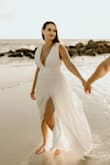 The dress was perfect for my occasion. The only issue I had was with the zipper. It got stuck and broke! I had to have it replaced. Other than that, I loved it! I used boobie tape to keep the girls in and that worked well. It was soft and had a beautiful flow. - Hannah S.