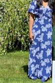 Beautiful dress! Fabric is light and flowy, it fits nicely on my body but it's too long for a shorter person like myself. I had the dress hemmed, about 6 inches were removed. Over all it's a nice casual dress for warmer weather. - Ratima C.