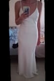 The dress fits perfectly and looks very flattering! it's true to size and very comfortable! The dress goes down to the floor which is great considering my height (5'10). The material is great and not see through! I definitely recommend it! - Georgia A.