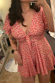 This is an adorable little romper, very flowy and very short. Be carful when you bend down with this on! The coverage under the arms is a little loose so if you raise your arm you might accidentally flash someone. Solved with spanks and clothing tape. - Christina Z.