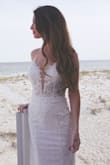 Unfortunately they didn't have size 0, so I had to order a size 2 and get it altered.. BUT it is such high quality and so gorgeous! Can't believe I got my wedding dress for under $300. Was perfect for my beach wedding! - Dalis C.