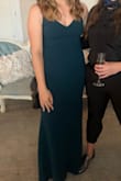 Amazing dress ! Fabric is thick and very flattering in all the right places. Got tons of complaints all night. I would say the color is more of a teal than forest green but still love it. - Savanna H.