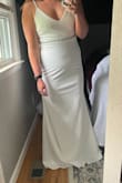 I ordered both a L and XL, ended up keeping the XL only because it seemed to be a bit more forgiving! The adjustable straps make it look "cheap". Although you need a bra, I considered having cups sewn it to eliminate being so revealing.  I did add a beaded belt to see if that was the look I wanted. Not sure this will be what I wear on my big day but I do like the dress. - JAMIE E.
