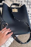 This bag is perfect! I love the studs down the strap. It's not too small or too big. - Ashley S.