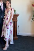 I wore this as a guest to a spring wedding. I probably would have stuck with the XS but didn't realize the zipper goes further down the back than I thought, and therefore I COULD have fit in it. But the Small worked fine. It was slightly long but I had on heels so it was manageable. And I had to safety pin the top together because it kept slipping. But other than that I got tons of compliments. I would suggest trying to find a way to de-wrinkle better than I could though! - Jessica E.
