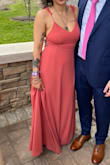 This dress was extremely comfortable in terms of the fabric, quality, and how flowy it was. It had beautiful little details like flowy details on the straps and buttons on the back. I wish the straps were a little thicker than spaghetti straps because they were difficult to adjust easily. I wore 2-3 inch heels but it was still dragging on the ground so I had to pick it up every time I walked. My biggest issue with the dress had to do with the snap on the back above the button detail. Everything seemed to fit snuggly until the snap. I couldn't take a deep breath without it popping open so I had to actually remove the snap and reattach it closer to the closure. I have muscle and am not extremely thin, so it was super frustrating to have to tailor the snap but also made me self-conscious it was going to pop or was showing (I was limited on time otherwise I would have went for a different dress). - Rebecca C.