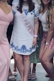 I wore this dress to brunch for my bachelorette party! It was super cute and fit true to size other than being a bit short, and my only complaint was that it wrinkled very easily (as pictured). I even steamed it beforehand. - Elaine D.
