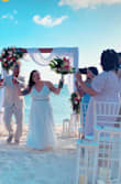 This dress was stunning for my Aruba wedding ceremony! It fit the beach vibe but didn't lose any of the wedding dress feels! Stretchy and three light layers on the bottom half. I got it altered and it was just stunning... didn't need a bra at all. - Cassandra V.