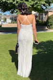The dress is beautiful I used on my wedding day! My only concerns are first that it came a little frayed on the bottom, very minimum but it did, and second that shoulders are maybe too thin for the dress weight so it gives you a little pain after awhile, but looks amazing still. I loved it and got lots of compliments. - Carolina S.