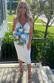 I wore this dress for my courthouse wedding. It was perfect for the occasion.  I loved how simple yet elegant it was- and the price couldn't be beat.  I plan on bringing this dress to my destination wedding and wearing it after my reception to continue the party in ! I paired this dress with Lulus Taylor block heels in off white (Since I was and continue to be unsuccessful finding white shoes). The only thing I could complain about was the top part being a tiny bit lose and unsupportive around my boobs. - Meghan D.