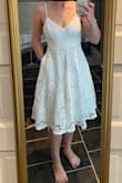 Love the cut and fit of this dress. Very flattering on me. I am usually a petite and worry about length overwhelming me, but this hits right above my knee and looks great. It's a little loose in my bust and waist, but the straps adjust and it will be great to have the extra room for the heat of summer. Very excited to wear for my bridal events. - AnnaMarie B.