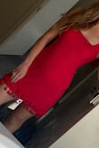 This dress was super flattering and received a ton of compliments. The warm red color nodded towards coral while still definitely being red. The fabric is a nice textured weave that feels and looks expensive. The skirt length was short enough to be flirty while long enough to wear to a family event. Buy this& it just works! - Loraine Z.