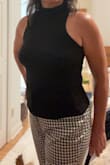 I normally wear a Medium and the Small fit. Probably could have also got the Medium just for the top 1/3 to have a little more room. The bottom 2/3rds felt very comfortable. Looks nice with skirt or jeans. - Christina C.
