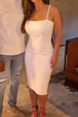 Loved this dress for the rehearsal dinner before my wedding. I probably should have sized down because it had more stretch than I expected, so it did bunch up a bit for me. A medium likely would have been just right, but still felt great in the dress! The material is nice and thick so under garments did not show. - Mandi M.