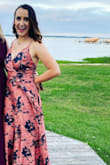 Hi! I wore this dress to a wedding and it was very flattering and looked nice in photos, however the fabric felt pretty cheap. A little more red than the picture too. I ordered a small and a medium and went with the small because the fabric had very little give. Not great for someone small breasted, the boobs were gaping but the stomach was tight. - Courtney