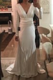 I got this for my wedding in July, I wanted a modest, long sleeve dress to cover up my sleeve tattoos that was not lace. This has some decent stretch and the material is good quality. It was a bit long, I kept tripping during my practice runs so I had it hemmed about 2-3 inches and it just barely hits the floor now. I have an athletic body type (wide shoulders/back, small waist/hip) and this really accentuates any imperfections you have so if you want something that is more forgiving this might not be the dress for you. Photo is before alterations. - Anna G.