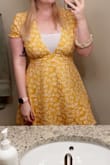 My husband surprised me with this dress and I am in love!! It fits perfectly and the material is so light and great for summer! It does have a deep plunge neck but I wore a white tank under it to work and it looked fine, on the weekends I don't bother with the tank and it still looks fine :) - Jaelyn B.