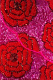 I ordered this because I liked the contrast of what I thought was light pink and red-orange; the specific color combination I was looking for. When I received the item, it was fuchsia and bright red. The clutch itself is well made, although the beading is only on the front. Overall, I was dissatisfied with how drastically different the colors were from the photo. - Olivia B.