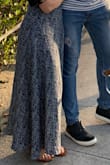 I had originally gotten a size small and it fit a little tight at the waist. Not super uncomfortable but definitely fitted. The size medium still fits really well but have more room to eat and move around. Size medium length is also more versatile. I can wear sandals and heels. - Rebeca S.