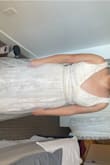 The belt just hit at the wrong angle. Because I'm short I would have to cut any dress I order. Would also have to alter the top to fit a shorter torso. Easy fixes. - Kellie T.