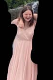 The dress was true to size just Measure before you order! I did have to pin the chest area but I still loved it. I used it for graduation photos and it was stunning the material wasn't too thick or too thin and layers to make it more flowing! Would get a dress off of here again! Great customer service as well - Megan R.