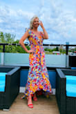 Wore this to a ladies event with a "summer glam" dress code and received sooo many compliments!! It's super lightweight and flows, great for those warm summer nights/outdoor wedding. The ruffles and the asymmetrical sleeve add a little extra. Trust me, you need this dress! - Amanda K.