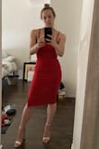 Material bunches a little at my waist but it's not an issue, it's very comfortable and stretchy. I don't need a bra, it's supportive and makes my boobs seem perky (which they aren't on their own, so that's a plus.) It's a true classical red in natural lighting, it's not a bright poppy red like in the model photo. I'm wearing Lulus gold vegan sandals. - Kristin M.