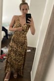 I bought this for an outdoor casual wedding. I'll either need to tape my bust or get the V stitched slightly because the little snap button pops open when I move my upper body. But I'm keeping it! - Kristin M.