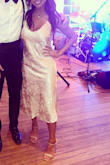 It is a beautiful dress! I bought it to wear at a friend's wedding. I wasn't sure what to expect because I had read that it runs a bit large and that it's suited for thin and taller women, but I'm 5'3'', 130 lbs and I thought the fit was good-- with the caveat that if I had more time I would have took it in so it can be more cinched at the waist. You can see what I mean in the photo. I loved it anyway! - Banan R.