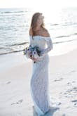 This dress was everything I wanted for our beach elopement! The material was great and stood up to walking in the water and sand. I got so many compliments on how this was the most beautiful dress people had ever seen! It was stunning in our photos. - Sarah H.