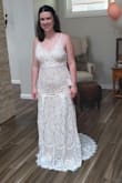 This dress is really beautiful in person, the nude underlay is a little darker than I expected but with the lace top layer it really pops in pictures. The overall fit was good as far as sizing (I tried a medium), I just didn't like how it looked on me. The line for the bottom of the dress hit at a less flattering spot on my body because I have shorter legs. The details at the bottom of the dress/train are really beautiful though. - Ashley D.