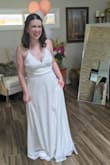 This dress was very cute, light, and airy. The top was a little loose on me compared to the other medium sized dresses I tried on, but I think a small would have been too small for me and it probably would be an easy alteration to get the top to fit more snug. This didn't end up being my dress but I thought the scallops on the top were very cute. - Ashley D.