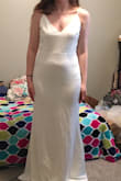 My wedding dress! I got so many compliments on this dress and my wallet is breathing a sigh of relief that I didn't have to spend hundreds or thousands. Paired it with a cape veil and a thin crystal belt and it was perfect. Oh so comfortable, and really sturdy, quality material for the price! The cape veil hid the adjustable straps but you can always have these permanently sewn in the the right height by a tailor if you don't have a cape. Low quality pic is before alterations. For the wedding I had these alterations: the top pulled in to fit more tightly and the dress shortened in the front so I could walk. Before alterations the bottom did fit perfect while the top was a bit too loose on my bust (I'm a classic pear shape). I also bought the small, which fit me perfectly on the bust, but was too tight for my comfort on my butt and abdominal area (you could see everything due to tightness there). So pleased with this dress!!! - Elizabeth R.