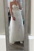 I absolutely love this dress! I'm wearing it for my wedding! It fits true to size! I am only going to tailor it to take a few inches off the bottom. I have to tailor most dresses anyway for my height.
This dress really feels and looks designer. Amazing for the price! So excited to have some beautiful wedding pictures in this! - Jennifer Z.