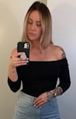 Great material that holds you in! I am large busted and the material holds me in enough and gives me enough support that I don't need to wear a bra with this top. I have a long torso and it doesn't ride up unbearably like some bodysuits do. - Jonelle S.
