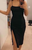 This dress is so flattering. I got my regular size and it fits perfectly. I love the slit which gives it a sexy vibe but not too revealing. The material is also very soft and stretchy. Love it! - Rebecca