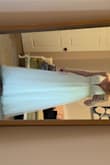 Beautiful princess gown. My dress was altered some to accommodate my baby bump by adding a simple lace to the zipper. The beading on the dress was very nicely done. I received so many compliments on the dress and was so excited to share the deal I got. People were amazed it was so affordable. The only thing I would change is the glitter on the skirt. It does come off and maybe is not completely needed. - Jennifer D.