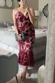 Bought this dress for an October wedding. I was nervous about ordering the wrong size but the reviews were so helpful! I am a true size 6 and usually between a small and medium. I went with the medium (I followed the size guide and reviews) and it fits perfect. It's a tighter fit so make sure to measure your hips before buying. This dress is stunning! - Lily D.