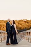 Ladies, this dress made me feel like a princess for princess for my engagement photos. The navy blue color was a perfect contrast for my summer background. Only con was how high the slits went! If I would have more time I would have given it a couple stitches to close them up! But DO NOT let it deter you! I will let the photos speak for themselves! - Sara H.