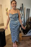 I used this dress for 4/7 of my bridesmaids and I LOVE it! I bought one for myself too!!! I had girls of all shapes and sizes in it and it looked AMAZING on all of them!! The photo is one of my girls in the medium! It can change colors a bit depending on the lighting. In darker lighting it looks a little more grey/silver but with brighter or natural light it definitely looks the beautiful blue shown here. - Meagan M.