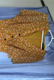 I'm very disappointed with the quality of this dress. It is thin, cheap material. The color doesn't match the picture. In real life, it is more muted yellow, which makes my skin look dull. - Vu Q.