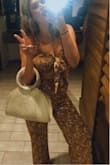 Light weight, and perfect for really any event. I wore this for a night out on a staycation in Florida with friends. The fit is true to size, the material is light weight, and washes well (I hung to dry). I'm 5'6 and the pants were high-waisted enough, and long either to wear with a flat sandal or a heel. I will order in black, and white print when sizes restock. - Hailey M.