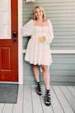This dress was super comfy and adorable but a bit larger than expected! - Emily M.