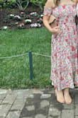 The dress was really cute and comfy! I ordered a xxs since that was the only size in stock. I'm typically an xs, but the smaller size didn't make a difference because of the top of the dress was stretchy and flowy. A bit long on petite women, but it was fine with heels. Definitely not a midi for petite women. - Natalie M.
