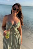 This dress is fun and versatile, you could wear it to a wedding or on the beach. It's pretty fitted on the top and at the waist. The material is thick. I was able to wear a strapless bra. It was a little tricky to iron and I'll probably get it dry-cleaned. Overall, fun dress! - Mackenzie S.